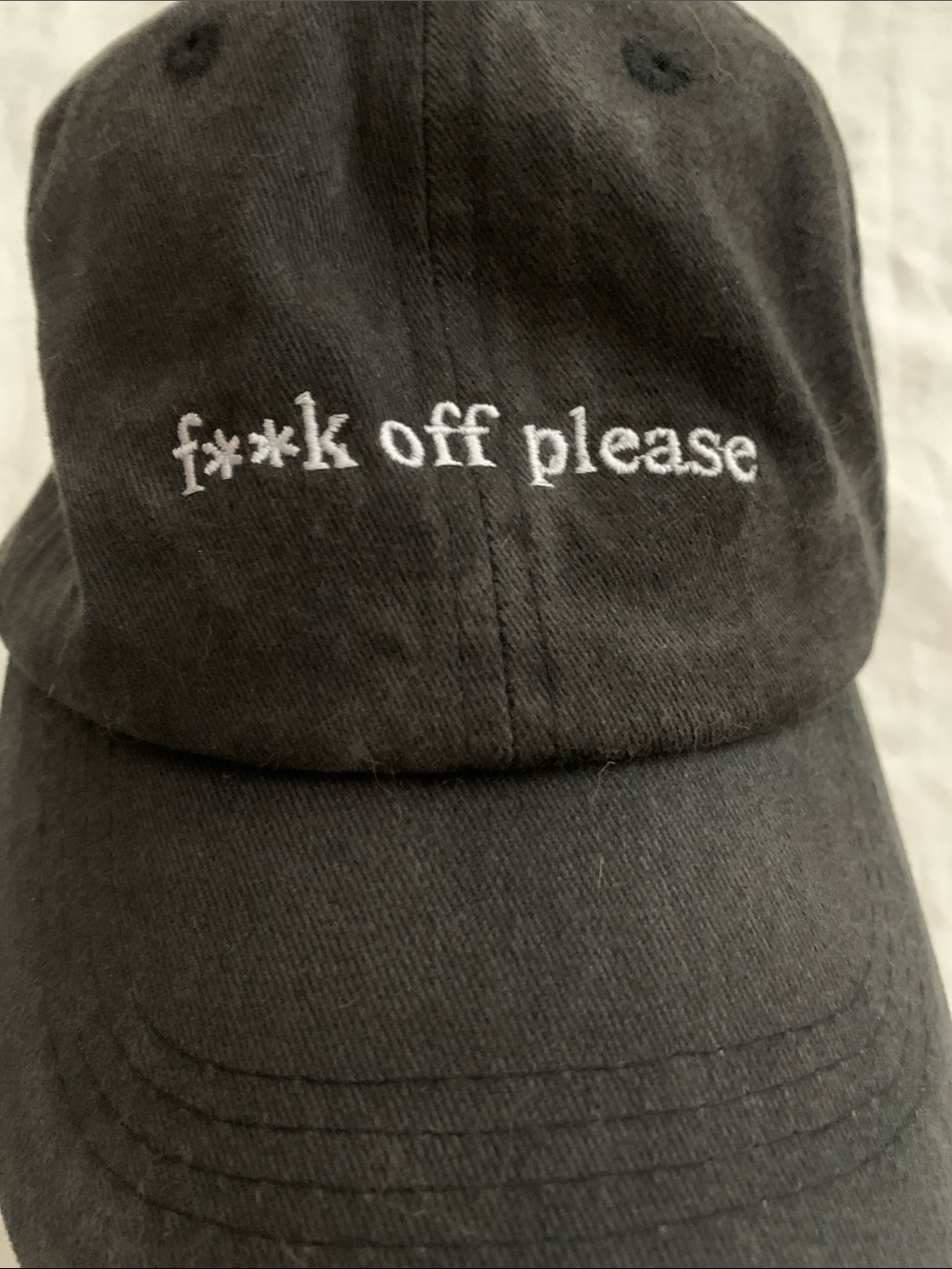 Black Baseball Cap with White Embroidered Text